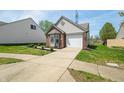 Attractive home with a well-kept lawn and paved driveway at 376 Lake Ridge Ln, Greenwood, IN 46142