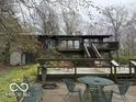 Backyard of home with large deck and seating area, perfect for enjoying the outdoors at 4491 W Stones Crossing Rd, Greenwood, IN 46143