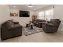 Inviting living room features neutral tones, comfortable seating, and abundant natural light at 5510 Chelsea Rd, Indianapolis, IN 46241