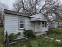 Shows a single story home with peeling paint and aging features at 5842 Greenfield Ave, Indianapolis, IN 46219