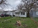 Modest single story home with a small yard and walkway at 5842 Greenfield Ave, Indianapolis, IN 46219