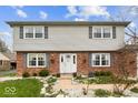 Inviting home with brick accents, charming shutters, and a well-manicured front garden at 6133 Buttonwood Dr, Noblesville, IN 46062