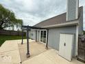 Backyard with a concrete patio area featuring a pergola at 6479 Enclave Blvd, Greenwood, IN 46143