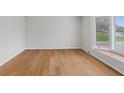 Bright living room boasts gleaming hardwood floors and a large bay window allowing for plenty of natural light at 7171 N Orchard Dr, Indianapolis, IN 46236