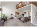 Open-concept living area with hardwood floors and plenty of natural light at 9664 Trail Dr, Avon, IN 46123