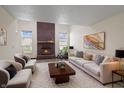 Bright living room featuring a brick fireplace and neutral décor at 9664 Trail Dr, Avon, IN 46123
