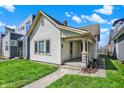 Quaint single-story home featuring a welcoming front porch, classic columns, and tidy landscaping at 1422 Olive St, Indianapolis, IN 46203