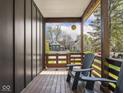 Cozy porch with wooden flooring and comfortable seating, perfect for relaxing outdoors at 1430 Fletcher Ave, Indianapolis, IN 46203