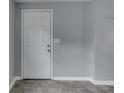 This interior view showcases the front door, gray walls, and modern tile flooring at 1623 N Centennial St, Indianapolis, IN 46222