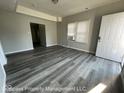 A view of a spacious living room with hardwood floors and lots of natural light at 1708 W 7Th St, Muncie, IN 47302