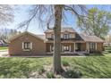 Attractive home with a well-manicured lawn and mature trees at 1772 Woodridge Pl, Greenwood, IN 46143
