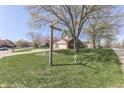Neighborhood view of a home with mature trees and well-kept lawns at 1772 Woodridge Pl, Greenwood, IN 46143