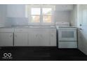 Bright kitchen featuring an oven and ample counter space at 312 S Gharkey St, Muncie, IN 47305