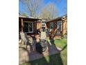 Inviting backyard patio with seating and a fire pit, perfect for outdoor entertaining and relaxation at 3614 Thorncrest Dr, Indianapolis, IN 46234