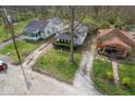 Overhead shot showing the property and surrounding neighborhood with mature trees at 3845 E 32Nd St, Indianapolis, IN 46218