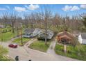 High-angle view capturing the property and its proximity to the street, other homes, and mature trees at 3845 E 32Nd St, Indianapolis, IN 46218