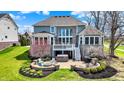 Outdoor living at its finest with a patio, fire pit, and lush landscaping at 4410 Miller Way, Westfield, IN 46062