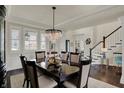 Elegant dining room featuring a chandelier and ample seating at 4410 Miller Way, Westfield, IN 46062