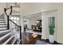 Grand foyer with hardwood floors and staircase leading to the second level at 4410 Miller Way, Westfield, IN 46062
