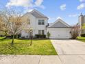 Charming two-story home with a well-manicured lawn, attached two-car garage and inviting curb appeal at 45 Wisteria Way, Westfield, IN 46074