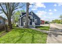 Attractive exterior view of a blue home highlighting its curb appeal and manicured lawn at 507 Dr Martin Luther King Jr Blvd, Anderson, IN 46016