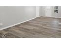 Bright living room featuring modern wood-look flooring and fresh neutral paint at 507 Dr Martin Luther King Jr Blvd, Anderson, IN 46016
