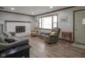 Comfortable living room featuring a large window and stylish furniture at 5555 W Vermont St, Indianapolis, IN 46224