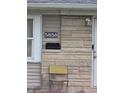 A close up of the home's address marker, showing number 5858 and a metal folding chair at 5858 E 44Th St, Indianapolis, IN 46226