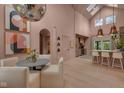 Bright, open-concept dining and kitchen with skylights, a disco ball, and modern fixtures at 6185 Evanston Ave, Indianapolis, IN 46220