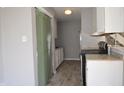 Kitchen showcasing white cabinetry, black appliances, and light gray walls at 6512 Lupine Ter # 6512, Indianapolis, IN 46224
