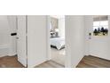 Bright bedroom featuring a comfortable bed with a door leading to the outside at 965 Penrose Pl, Danville, IN 46122