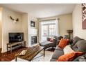 Comfortable living room featuring a fireplace, plush sofa, and a bright sliding glass door at 1057 3Rd Nw Ave, Carmel, IN 46032