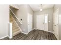 Inviting entryway with wood-look floors and a staircase at 10839 Cedar Pine Dr, Indianapolis, IN 46235