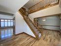 Grand foyer featuring hardwood floors, staircase, and a view into the formal dining and living areas at 1394 Cherry Tree Rd, Avon, IN 46123