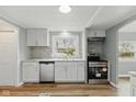 Modern kitchen featuring stainless steel appliances, stylish backsplash, and bright white cabinets at 14 Fountain Lake Dr, Greenfield, IN 46140