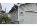 Close up of attached garage featuring gray exterior and carriage door at 1414 Waldemere Ave, Indianapolis, IN 46241