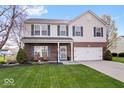 Charming two-story home featuring brick accents, manicured lawn, and attached two car garage at 19510 Pathway Point, Noblesville, IN 46062
