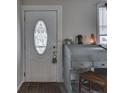 Inviting entryway with a charming vintage desk and decorative touches, adjacent to the front door at 213 N Walnut St, Edinburgh, IN 46124