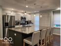 Beautiful kitchen with granite island, pendant lighting, and stainless appliances at 2335 Durham Dr, Indianapolis, IN 46220