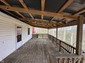 Large back deck offers great outdoor views and features sturdy wooden railings at 2975 High Rock Dr, Martinsville, IN 46151