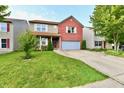 A well-maintained two-story house featuring brick accents and a spacious front yard at 3316 Gainesville Ct, Indianapolis, IN 46227