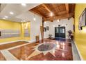 Spacious lobby with unique flooring design and wood beamed ceilings at 55 S Harding St # 301, Indianapolis, IN 46222
