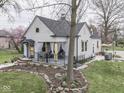 Charming single-Gathering home with a covered porch, manicured lawn, and mature trees at 57 Worman St, Indianapolis, IN 46227