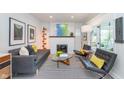 Bright and airy living room featuring contemporary furniture, stylish decor, and ample natural light at 5942 Primrose Ave, Indianapolis, IN 46220