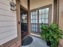 Welcoming entryway with black door, a window, a plant, and a Welcome sign at 599 Cielo Vista Dr, Greenwood, IN 46143