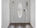 Elegant front door with decorative glass and sidelights, adding a touch of sophistication at 6846 Emerald Bay Ln, Indianapolis, IN 46237