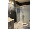 Updated bathroom featuring a tiled shower and modern vanity at 801 N Denny St, Indianapolis, IN 46201