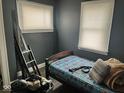 Small bedroom featuring a bed and two windows at 801 N Denny St, Indianapolis, IN 46201