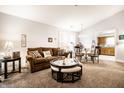 Cozy living room features plush seating, natural light, and an adjacent dining area with modern furnishings at 8116 Heritage Commons Dr # Bldg 24, Indianapolis, IN 46219