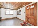 Bright living room with wood ceiling and natural light at 8644 S Kinman Dr, , IN 46164